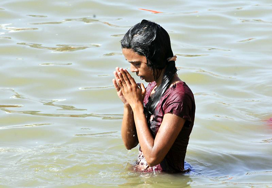 Taking Bath in Rādhā-kuṇḍa